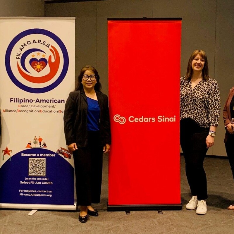 Janeth Zafra-Mauricio (middle) surrounded by speakers at Cedars-Sinai's admin training conference